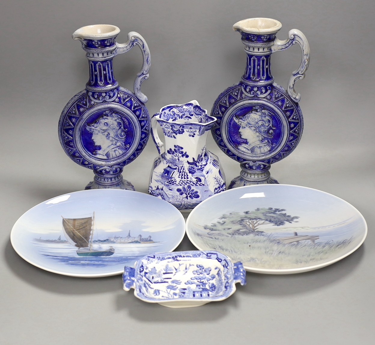 A pair of Royal Copenhagen plates, a pair of German pottery ewers a blue and white dish and pickle dish, plates 25 cms diameter.